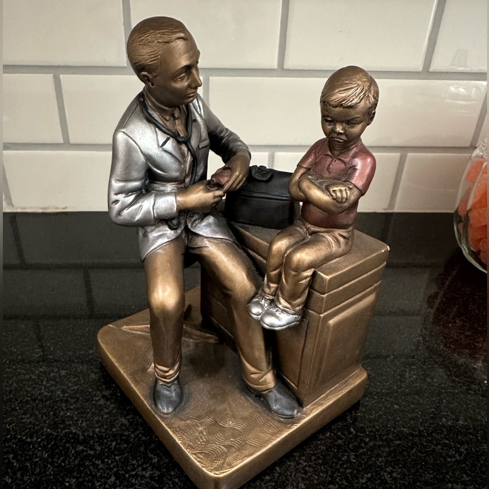 Bronze Doctor and Child Sculpture